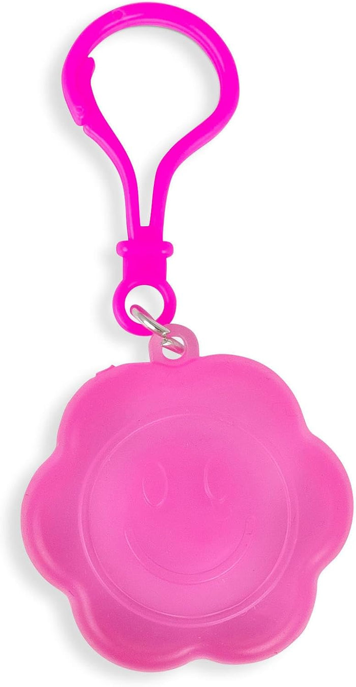Neon pink flower-shaped squishy charm with a smiley face and a matching neon pink plastic keychain clip.