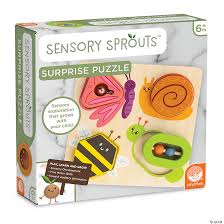 Boxed wooden puzzle with colorful insect pieces: pink butterfly, orange snail, yellow bee, and green caterpillar rattle.