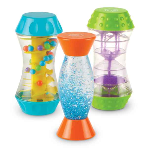 Three hourglass-shaped sensory tubes with teal, orange, and green caps featuring beads, blue glitter, and purple sand.