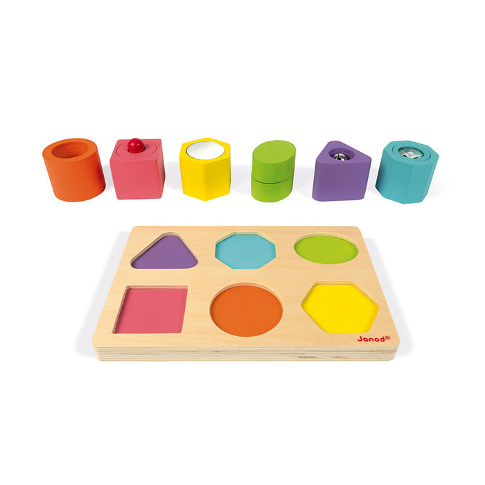 Six colorful sensory blocks featuring mirrors and bells above a matching wooden shape-sorting puzzle board.
