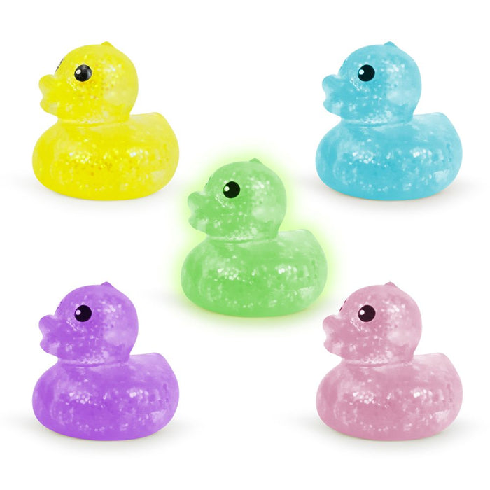 Five translucent, glittery rubber ducks in yellow, blue, glowing green, purple, and pink on a white background.