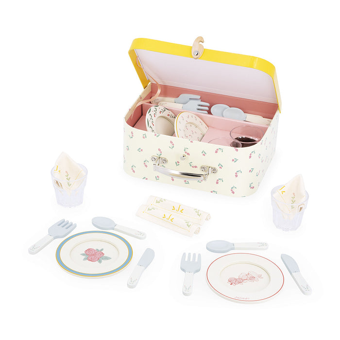 Floral wooden toy dinette set with plates and cutlery in a vintage floral suitcase with a yellow lid.