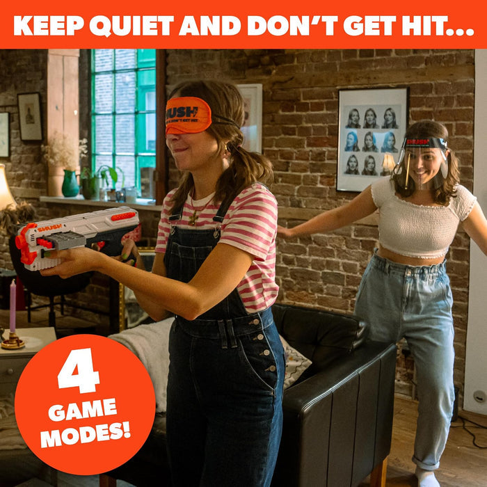 Blindfolded woman in overalls holds a white toy blaster while a woman in a face shield sneaks up behind her.