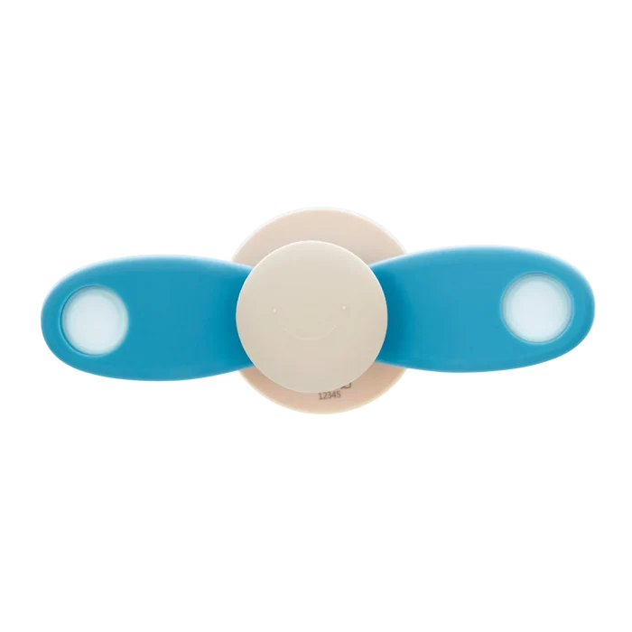 Blue two-blade propeller spinner featuring a beige center with a smiling face and white circular accents.