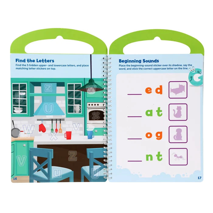 Spiral-bound activity book with green handles, featuring colorful letter-finding and phonics word-matching games.