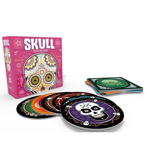 Pink Skull board game box with colorful round discs and square cards featuring vibrant sugar skull illustrations.