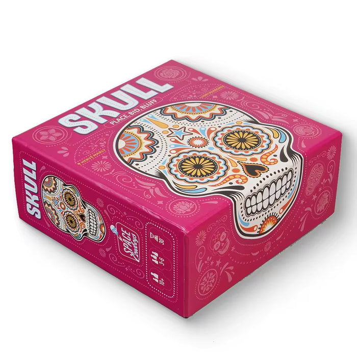 Pink square box for Skull board game featuring a large, colorful sugar skull illustration with floral patterns.
