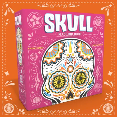 Pink board game box with a large colorful sugar skull design and bold white text reading Skull on an orange background.