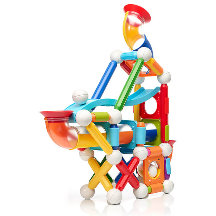 Colorful magnetic marble run building set with multi-colored rods, white spheres, and clear curved tubes.