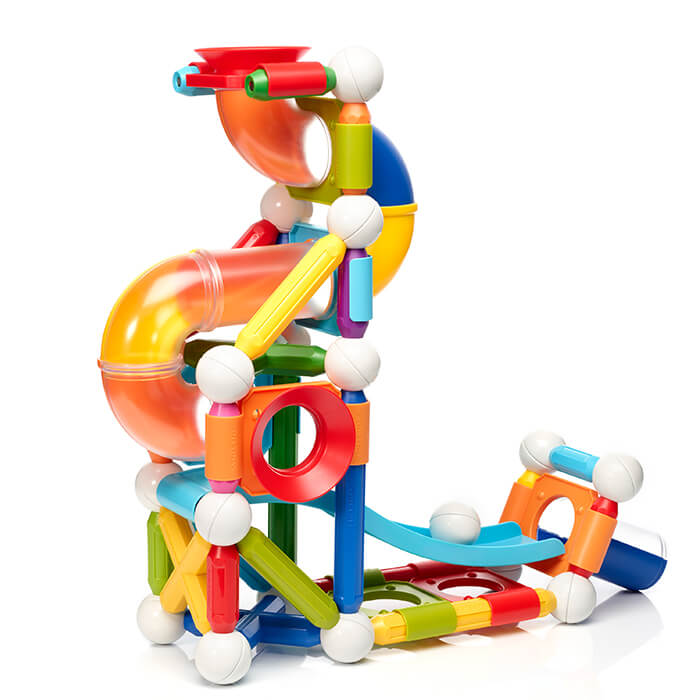 Colorful magnetic ball run toy with primary-colored rods, white joint spheres, and translucent orange tubes.