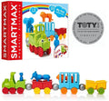 Colorful toy train box and assembled magnetic set with green engine, animal figures, and silver connecting spheres.