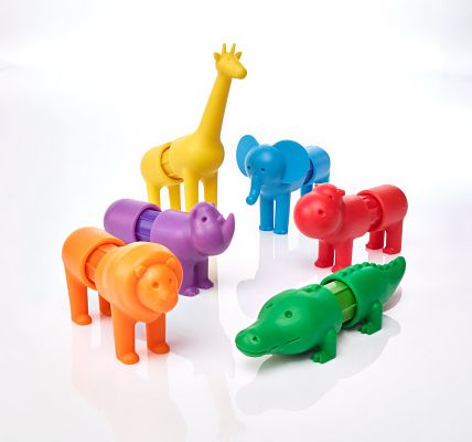 Six chunky, colorful magnetic safari animals including a yellow giraffe, blue elephant, and orange lion on white.