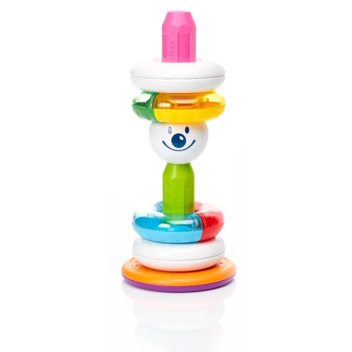 Colorful magnetic rings and a smiley face ball stacked on a green and pink pillar with an orange and purple base.