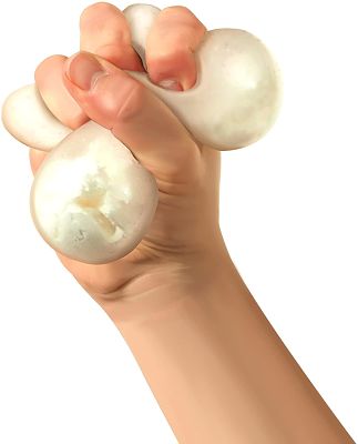 Hand squeezing a white, pearlescent stress ball, which is bulging between the fingers like soft snow.