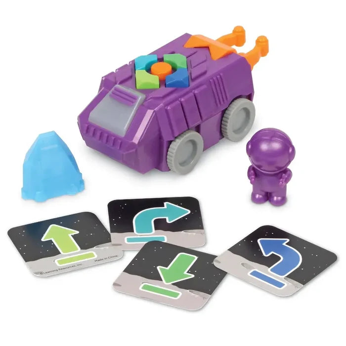 Purple space rover toy with buttons, coding arrow cards, a small purple astronaut, and a blue mountain accessory.