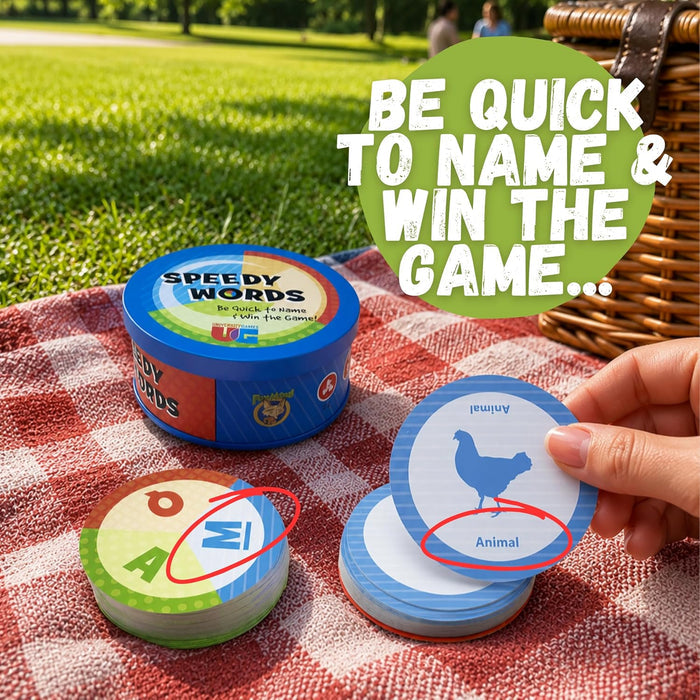Blue Speedy Words tin and circular cards on a picnic blanket. Red circles highlight the letter M and word category Animal.