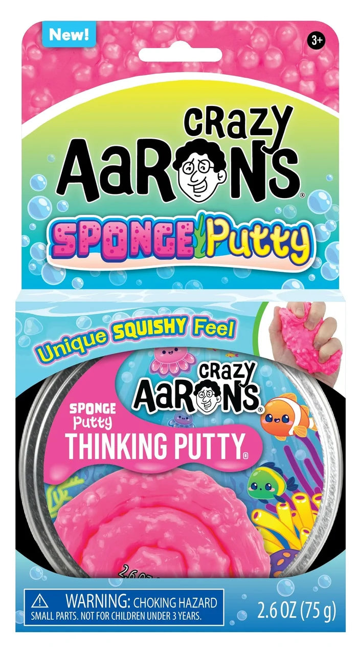 Pink lumpy putty in a round tin with sea-themed packaging showing cartoon fish, coral, and bubbles.