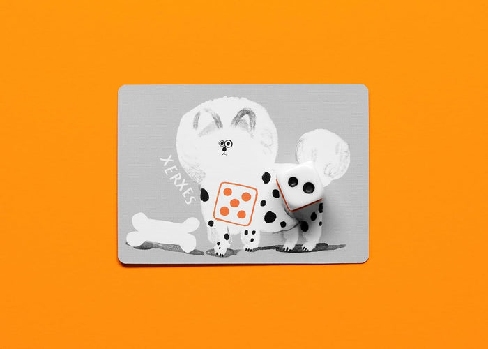 Gray game card featuring a spotted dog named Xerxes and two dice on a bright orange background.