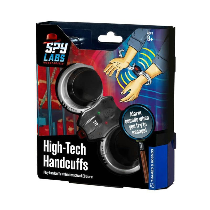 Spy Labs toy handcuffs box featuring black and silver plastic cuffs with an alarm and motion sensor illustration.