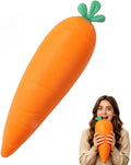 Large orange carrot-shaped squishy toy with green leaves held by a person showing its jumbo size.
