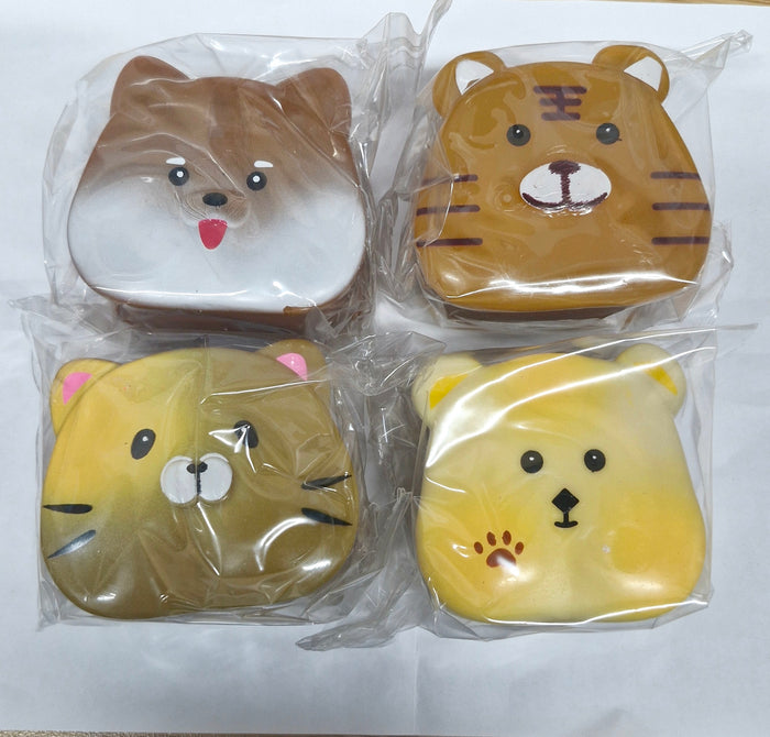 Four animal-faced squishies (dog, tiger, cat, and bear) in brown and yellow, individually wrapped in clear plastic.