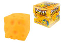 A square yellow squishy toy with holes resembling Swiss cheese beside its orange and yellow box.