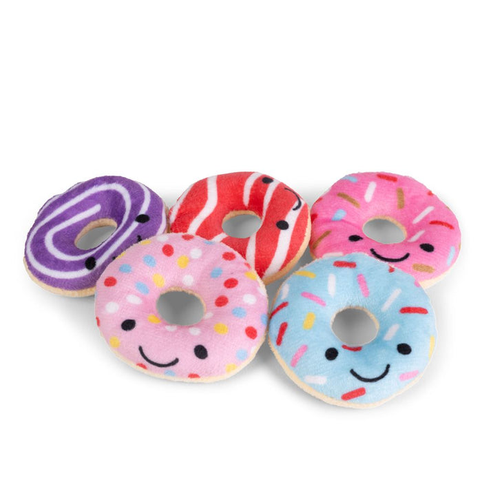 Five colorful plush donuts with cute smiley faces, featuring pink, blue, red, and purple swirl and sprinkle designs.
