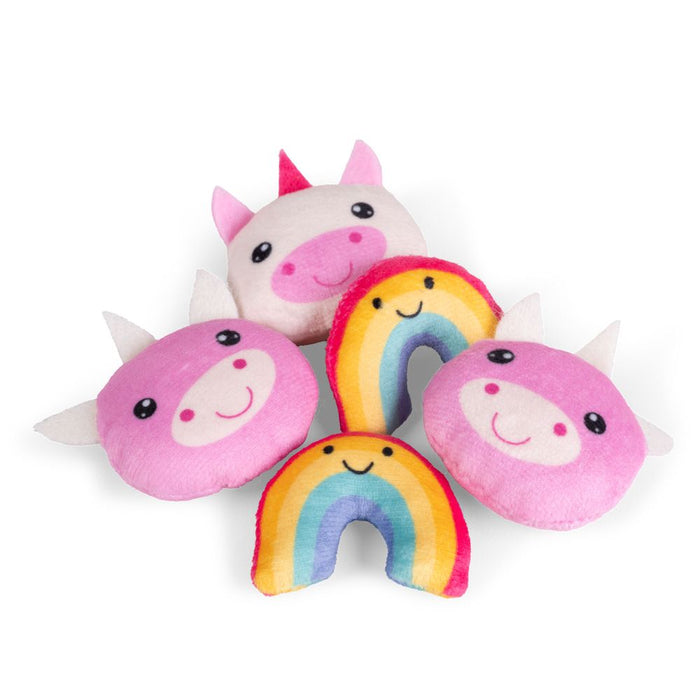 Five small plush sensory toys: white and pink unicorn heads and two colorful smiling rainbow arches.