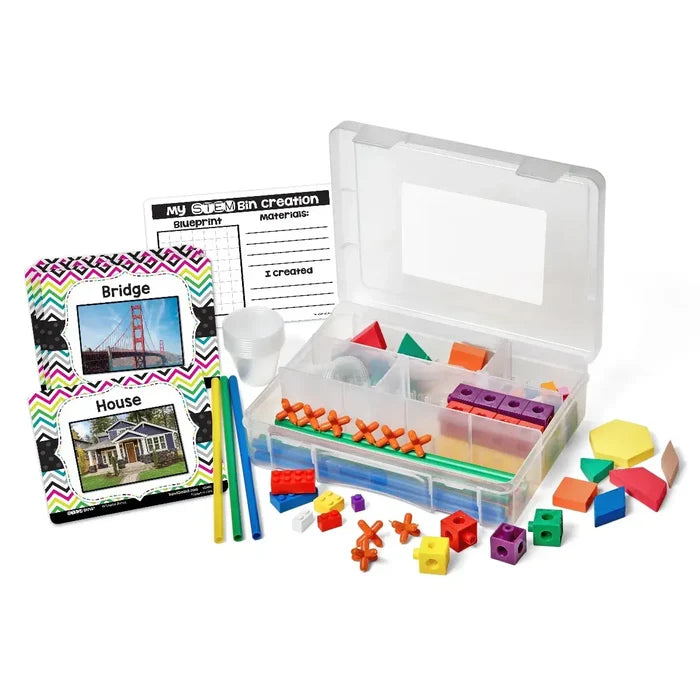 Clear bin with colorful blocks, cubes, straws, and activity cards showing a house and bridge.
