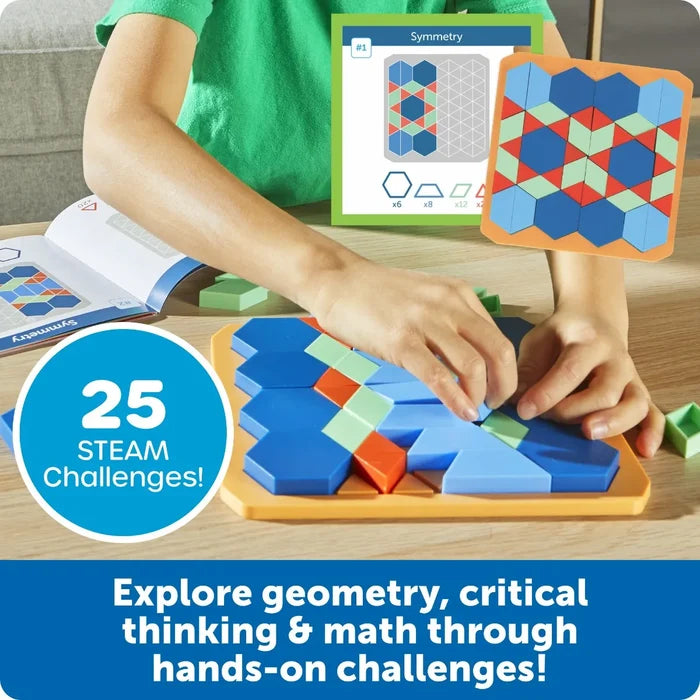 Hands placing blue hexagons and colorful blocks on a tray to match a symmetry pattern on a challenge card.