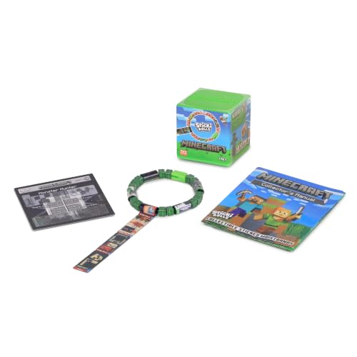 Green Minecraft cube, beaded sticker wristband with pull-out roll, and collector manuals on a white background.