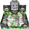 Retail display box containing individually bagged white and black panda squishy toys with green clips.