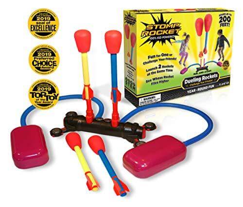 Colorful foam rockets with pink stomp pads, blue air hoses, and yellow product box with award seals.