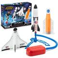 NASA toy set with three foam spacecraft in white and orange, a blue tripod launcher, and a red air stomp pad.