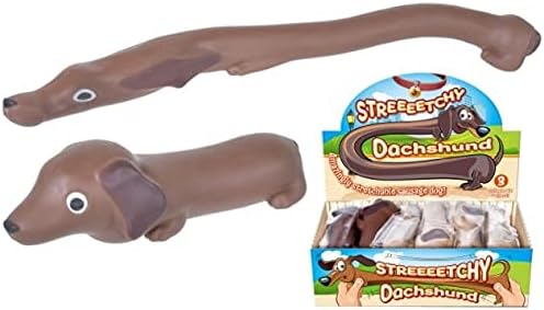 Two brown rubber dachshund toys, one unstretched and one stretched out, next to their colorful retail display box.