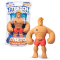 Tan muscular blond figure in red trunks, shown in and out of blue branded blister pack packaging.