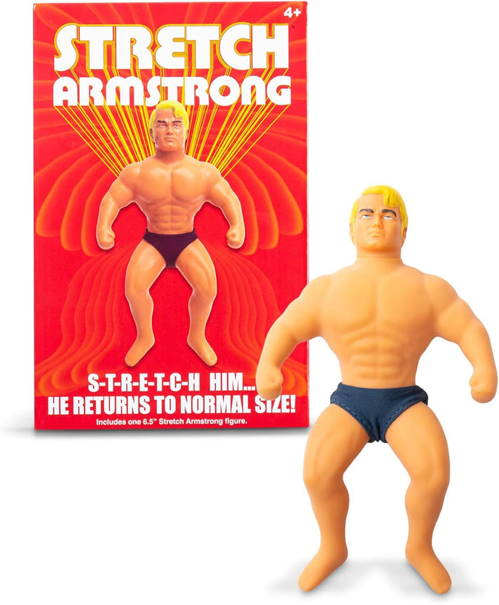 Muscular blond action figure in dark trunks next to its red and yellow retro-style packaging box.