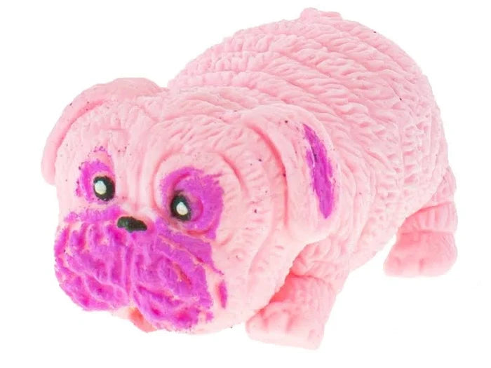 Pink wrinkled rubber toy dog with magenta patches on its face and a textured, squishy body.