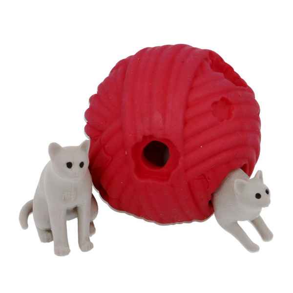 Two white kitten toys with a red textured yarn ball; one sits beside it and one peeks out from a hole.