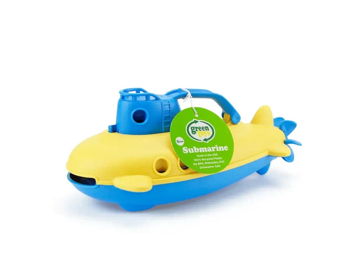 Yellow and blue toy submarine with a handle, portholes, and rear propeller, featuring a green circular product tag.