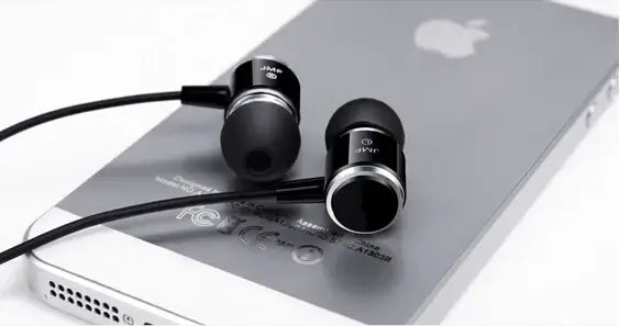 Super Bass Earphone For IPhone 5 5S 4 Samsung resting on a silver iPhone