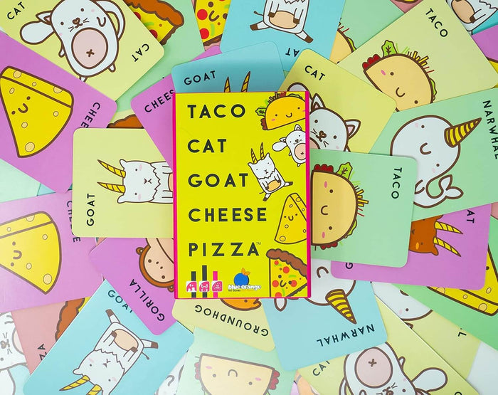 Yellow game box surrounded by colorful cards featuring cute cartoon animals and food items on a light blue surface.