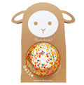 Multicolored confetti ball in sheep-shaped brown cardboard packaging with a white face and Ratatam branding.