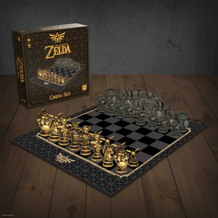 Gold and dark metallic Zelda character chess pieces on a black board next to its black and gold collector's box.