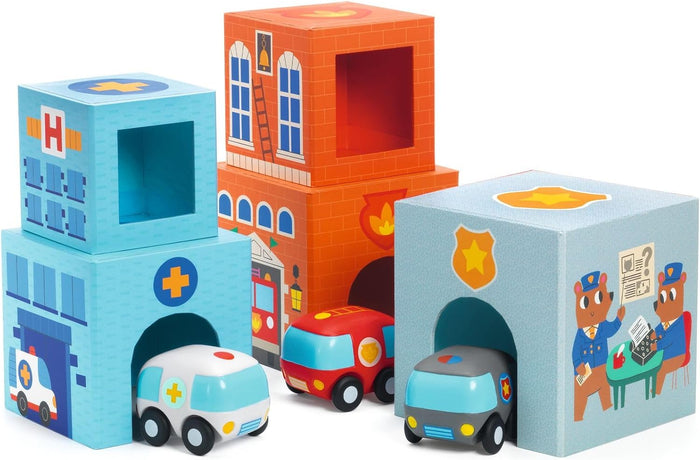 Colorful cardboard stacking cubes shaped like emergency buildings with three matching toy cars parked in arched openings.
