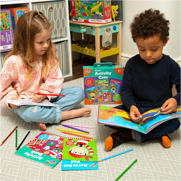 Kids using a teal Galt activity case kit with stickers, coloring books, and pencils on a grey patterned play mat.