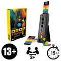 Yellow board game box next to a black vertical tower, colored circular discs, and rainbow-striped trivia cards.