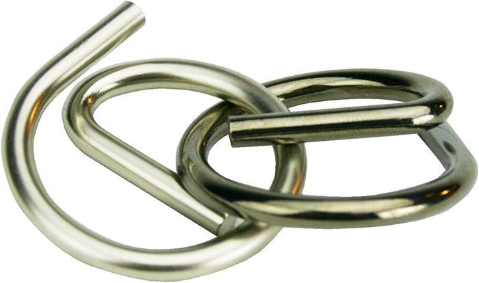 Polished silver metal puzzle with two interlocking pieces featuring curved loops and straight bars.
