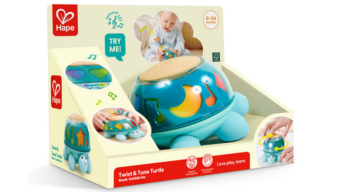 Hape Twist & Tune Turtle toy in packaging, with a light-blue plastic body and a wooden-topped translucent shell.