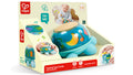 Hape Twist & Tune Turtle toy in packaging, with a light-blue plastic body and a wooden-topped translucent shell.
